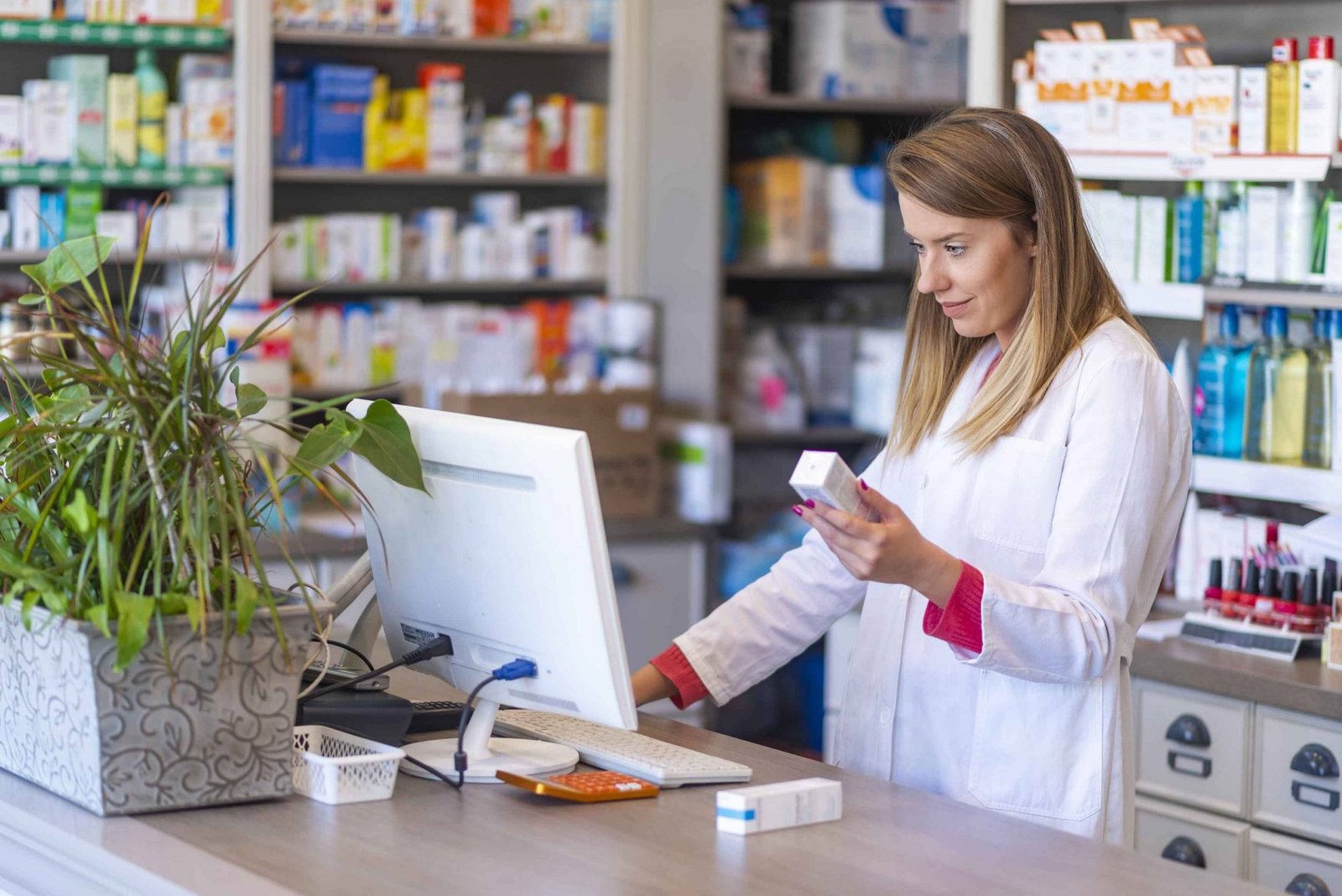 Veritas Pharma pharmacist reviewing healthcare products
